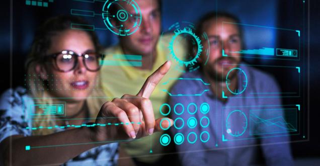 People looking at pointing to data on a screen