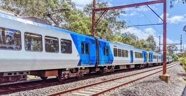 Image of a Melbourne Metro Train moving over rail.