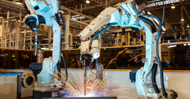 Industrial robots welding in a factory