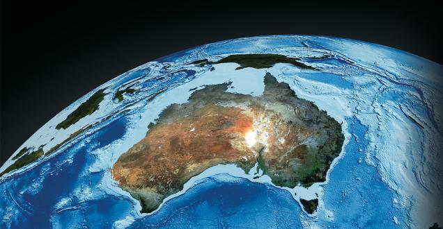 Satellite photo of Australia with swirling ocean.