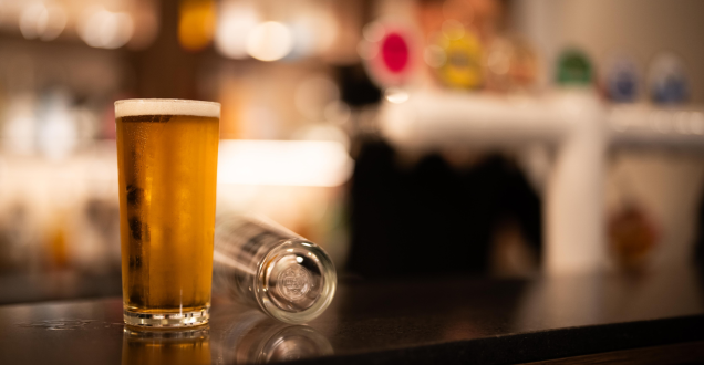 A glass of beer at a bar