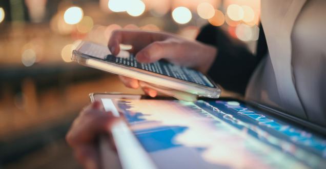Modern digital tablet showing AI data dashboard and finance chart under ambient light. Represents machine learning, big data visualisation, and smart financial management in the new digital world.
