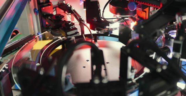 Robotic system assembles electronic components with high-speed precision, emphasising industrial automation, circuit production, and AI-driven electronics.