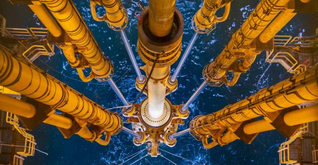 View of drilling equipment from an offshore oil and gas platform looking into the ocean