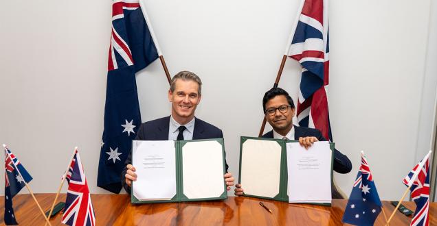 Australia’s Assistant Minister for Science, Technology and the Digital Economy, Dr Andrew Charlton MP and UK Minister for AI and Online Safety, Kanishka Narayan MP hold signed copies of the MoU.