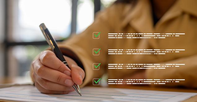 Business woman using pen to check off clipboard on table with overlay of floating ticked off checklist of abstract text