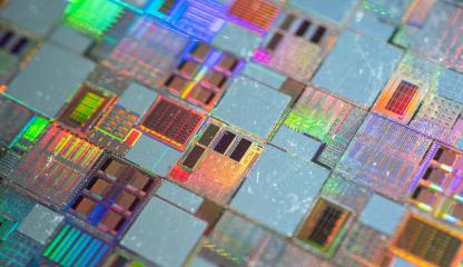 Close up image of semiconductor silicon wafer with text ‘Grant opportunity - International Partnerships in Critical Minerals Program – applications now open’. 