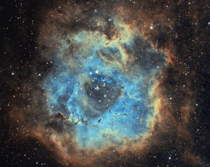 A blue and orange nebula in space