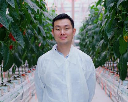 Alexander Soeriyadi, CEO and co-founder of Lleaf standing in one of the company’s greenhouses