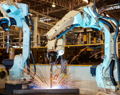 Industrial robots welding in a factory