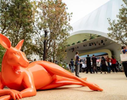 An orange statue of a kangaroo lying down outside the Australia Pavilion at the World Expo Osaka 2025.