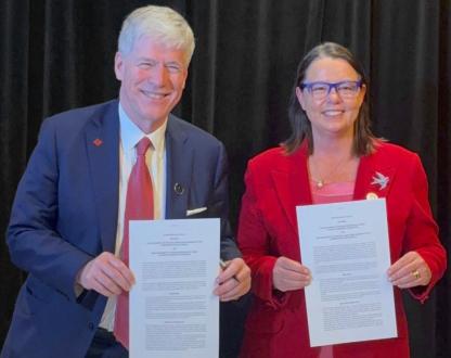 Photo of Minister for Resources and Northern Australia Madeleine King and Minister for Resources and Energy, Tim Hodgson holding signed copies of the declaration.