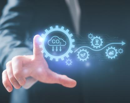 Hand touching digital icons symbolising sustainable industries