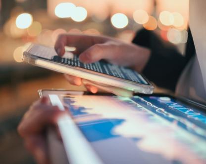 Modern digital tablet showing AI data dashboard and finance chart under ambient light. Represents machine learning, big data visualisation, and smart financial management in the new digital world.