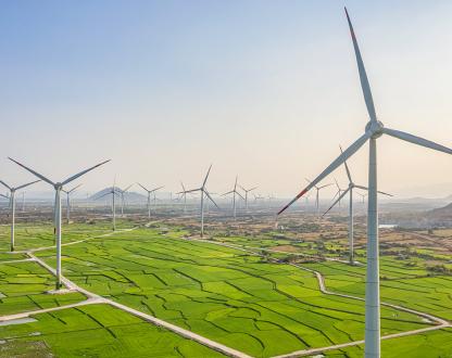 Wind turbines generating electricity on rice field at Phan Rang, Ninh Thuan, Vietnam. 