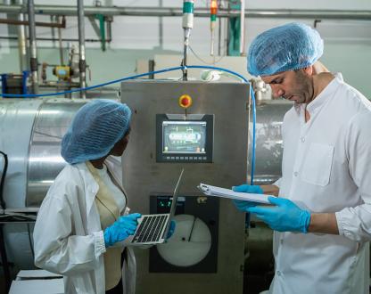 Food manufacturing facility with workers. 