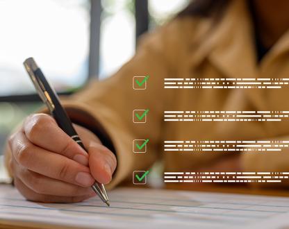 Business woman using pen to check off clipboard on table with overlay of floating ticked off checklist of abstract text